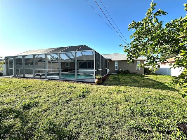 view of yard featuring a fenced in pool and a lanai