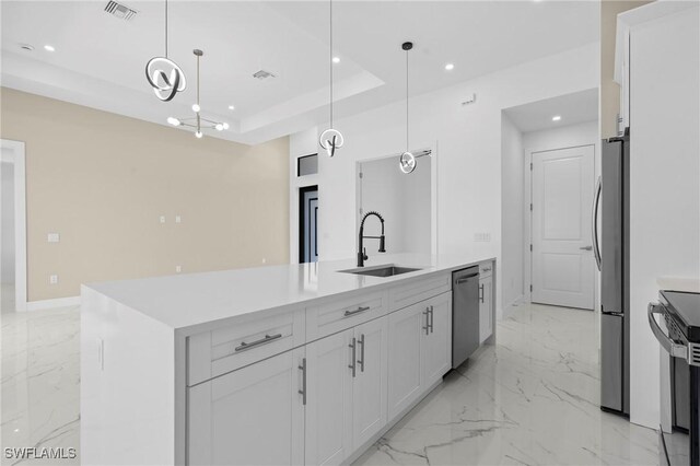 2705 68th St W, Lehigh Acres, FL 33971 - kitchen featuring a tray ceiling, a sink, visible vents, marble finish floor, and appliances with stainless steel finishes