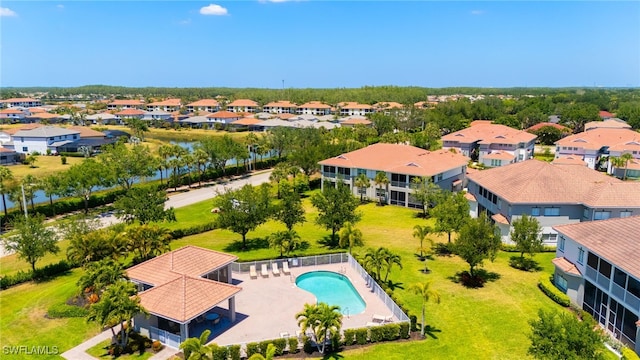 drone / aerial view with a water view and a residential view