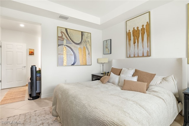 tiled bedroom featuring visible vents and baseboards