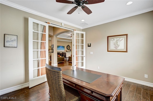 office space with dark wood-type flooring, a fireplace, baseboards, and a ceiling fan