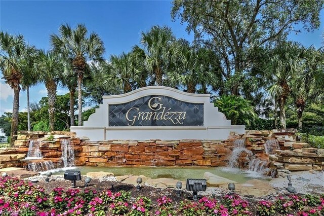 20211 Burnside Pl Unit 203, Estero, FL 33928 - community sign with a garden pond