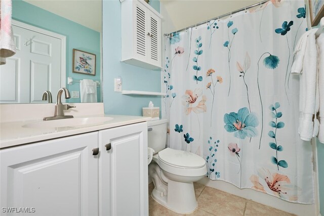 20211 Burnside Pl Unit 203, Estero, FL 33928 - full bathroom featuring toilet, a shower with curtain, vanity, and tile patterned floors