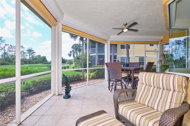 20211 Burnside Pl Unit 203, Estero, FL 33928 - sunroom / solarium with outdoor dining area and ceiling fan