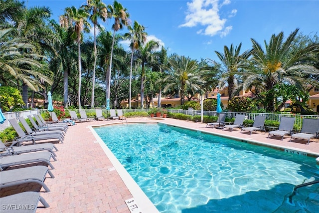 20211 Burnside Pl Unit 203, Estero, FL 33928 - pool with fence and a patio