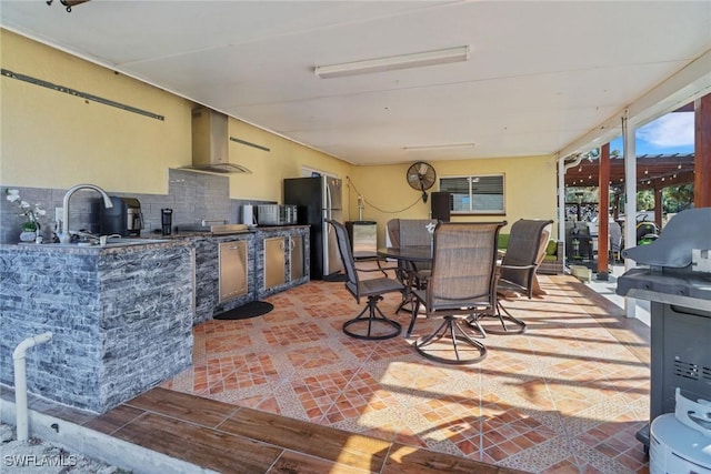 2420 6th Ave SE, Naples, FL 34117 - view of patio / terrace with a sink, outdoor dining area, and an outdoor kitchen