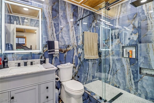 2420 6th Ave SE, Naples, FL 34117 - bathroom featuring a marble finish shower, tile walls, toilet, and vanity