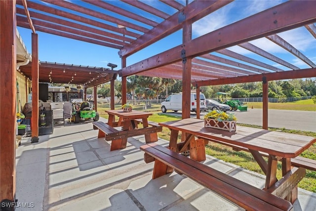2420 6th Ave SE, Naples, FL 34117 - view of patio featuring a pergola and outdoor dining area