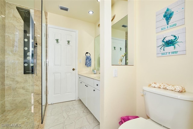 bathroom featuring visible vents, marble finish floor, a tile shower, and toilet