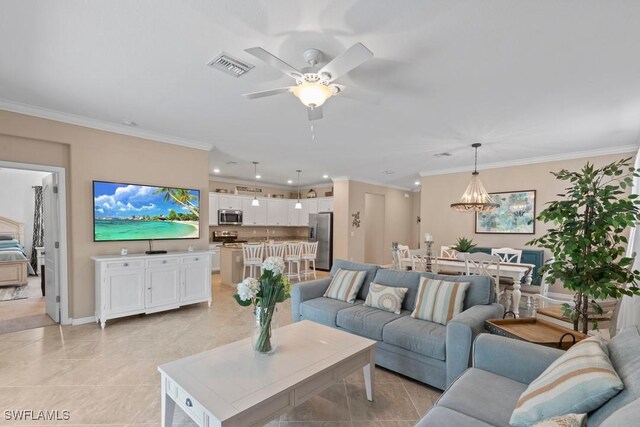 16148 Bonita Landing Cir, Bonita Springs, FL 34135 - living room with crown molding, ceiling fan with notable chandelier, visible vents, recessed lighting, and baseboards
