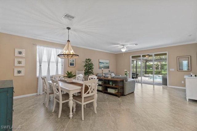 16148 Bonita Landing Cir, Bonita Springs, FL 34135 - dining space with crown molding, ceiling fan with notable chandelier, light tile patterned floors, visible vents, and baseboards