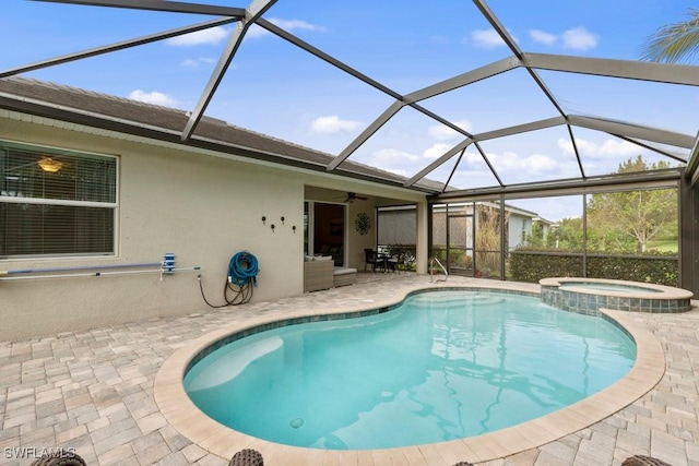 16148 Bonita Landing Cir, Bonita Springs, FL 34135 - view of pool featuring a patio, a pool with connected hot tub, and glass enclosure