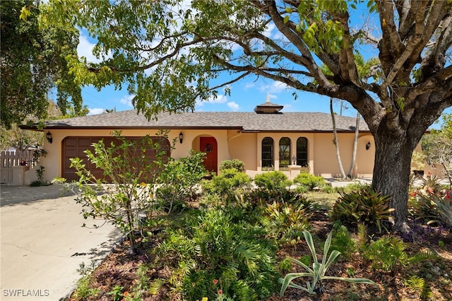 1011 El Mar Ave, Fort Myers, FL 33919 - ranch-style home with stucco siding, an attached garage, and concrete driveway