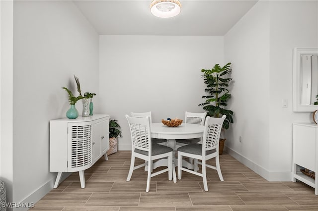 44372 Panther Dr, Punta Gorda, FL 33982 - dining space with baseboards and wood finish floors