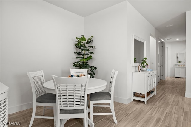 44372 Panther Dr, Punta Gorda, FL 33982 - dining area featuring baseboards, light wood finished floors, and recessed lighting