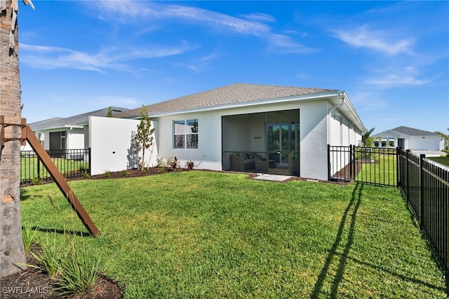 44372 Panther Dr, Punta Gorda, FL 33982 - rear view of property with a yard, a fenced backyard, roof with shingles, and stucco siding