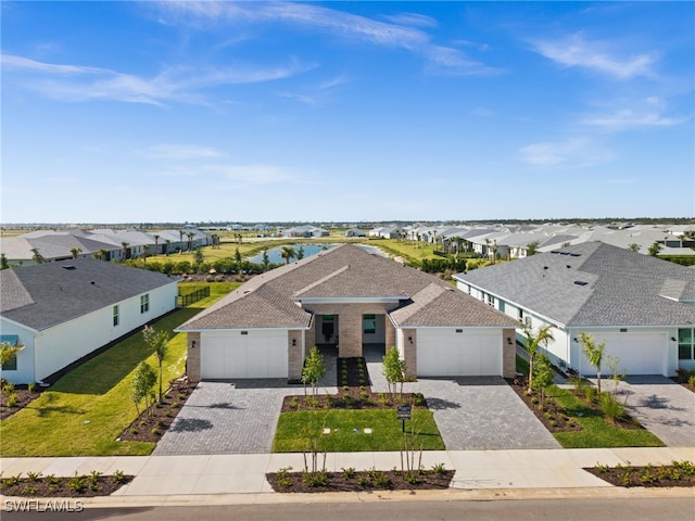 44372 Panther Dr, Punta Gorda, FL 33982 - view of front of house featuring a front yard, a residential view, decorative driveway, and roof with shingles
