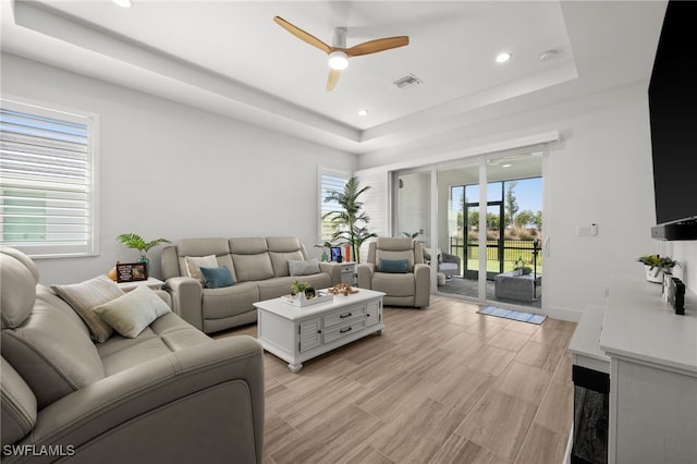 44372 Panther Dr, Punta Gorda, FL 33982 - living area with ceiling fan, a tray ceiling, light wood-style flooring, visible vents, and recessed lighting