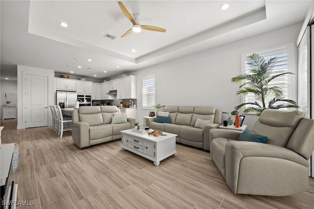 44372 Panther Dr, Punta Gorda, FL 33982 - living room with recessed lighting, visible vents, a tray ceiling, and ceiling fan