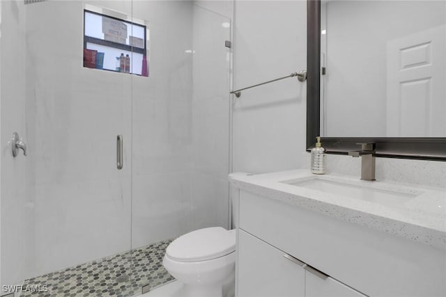 435 Pickford Ave, Lehigh Acres, FL 33974 - full bathroom featuring toilet, a stall shower, and vanity