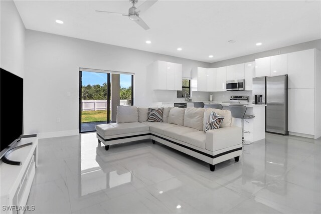 435 Pickford Ave, Lehigh Acres, FL 33974 - living area featuring a ceiling fan, light marble finish floors, and recessed lighting