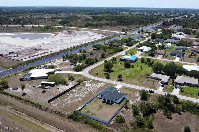 435 Pickford Ave, Lehigh Acres, FL 33974 - aerial view of property and surrounding area featuring a nearby body of water and nearby suburban area