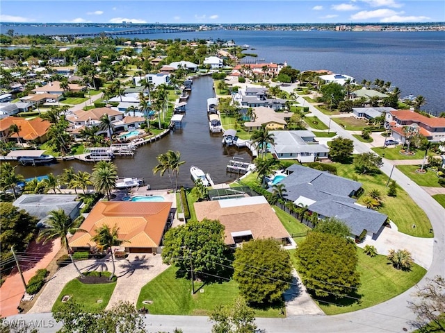 bird's eye view featuring a residential view and a water view