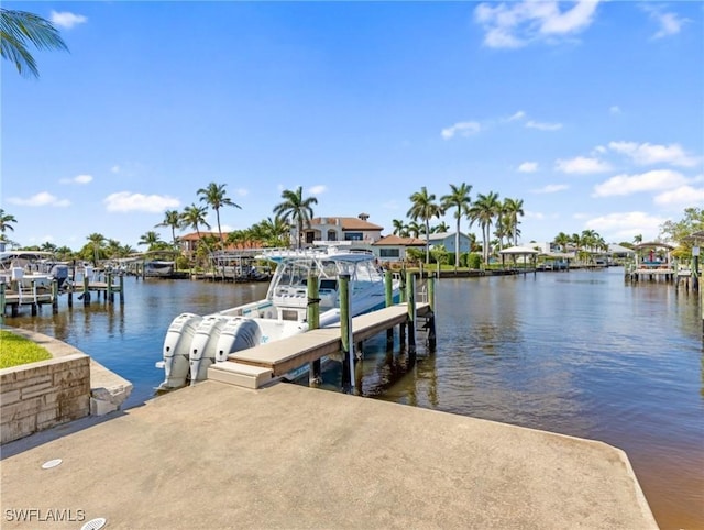 view of dock with boat lift and a water view
