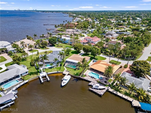 birds eye view of property featuring a residential view and a water view