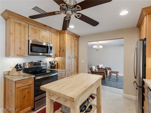 kitchen featuring appliances with stainless steel finishes, ceiling fan with notable chandelier, visible vents, and recessed lighting