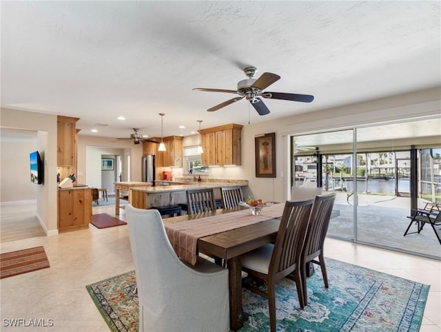 dining space featuring ceiling fan, recessed lighting, and baseboards