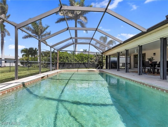 view of pool featuring a fenced in pool, a patio area, glass enclosure, and fence