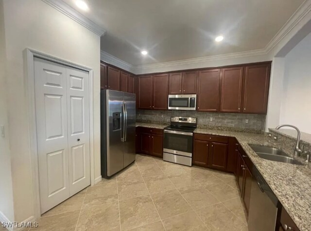 2035 Wellington St, Naples, FL 34120 - kitchen featuring a sink, tasteful backsplash, appliances with stainless steel finishes, and crown molding