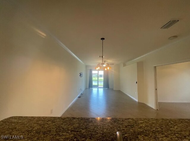 2035 Wellington St, Naples, FL 34120 - unfurnished dining area with crown molding, tile patterned flooring, visible vents, a chandelier, and baseboards