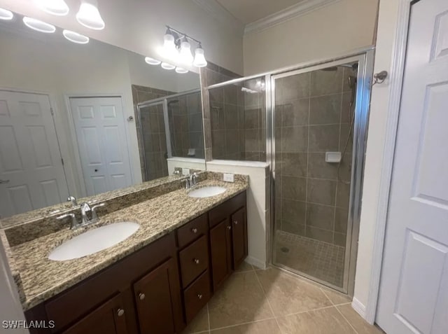 2035 Wellington St, Naples, FL 34120 - bathroom featuring a sink, tile patterned floors, a stall shower, and crown molding