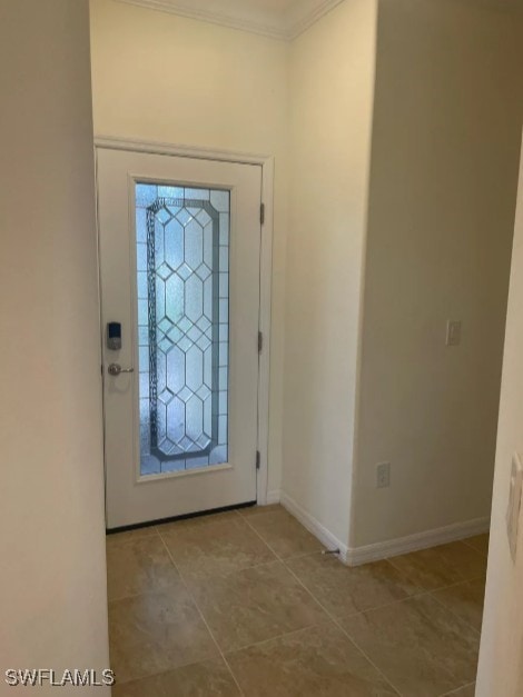 2035 Wellington St, Naples, FL 34120 - foyer with ornamental molding, tile patterned floors, and baseboards