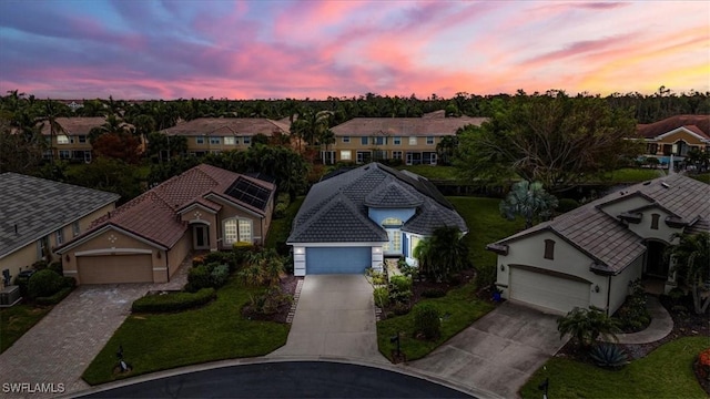 aerial view at dusk with a residential view