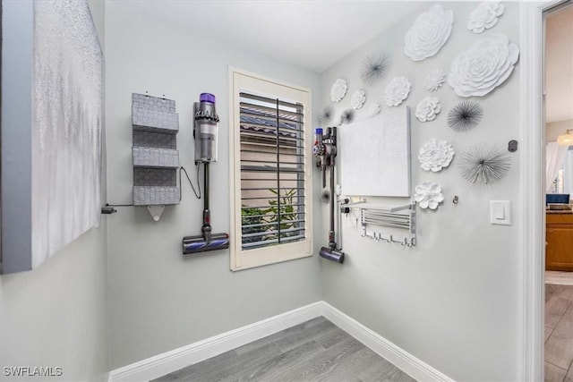 bathroom featuring baseboards and wood finished floors