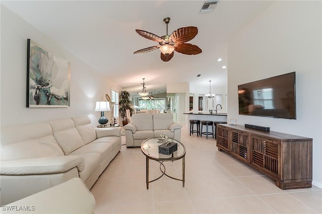 9241 Spring Run Blvd Unit 2202, Estero, FL 34135 - living room featuring visible vents, light tile patterned flooring, and ceiling fan with notable chandelier