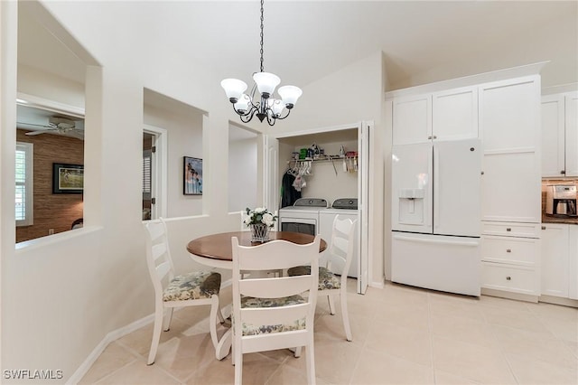 9241 Spring Run Blvd Unit 2202, Estero, FL 34135 - dining room with ceiling fan with notable chandelier, light tile patterned floors, and washer and clothes dryer