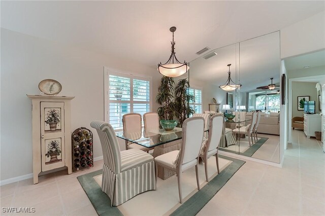 9241 Spring Run Blvd Unit 2202, Estero, FL 34135 - dining area featuring light tile patterned floors, baseboards, a ceiling fan, and visible vents
