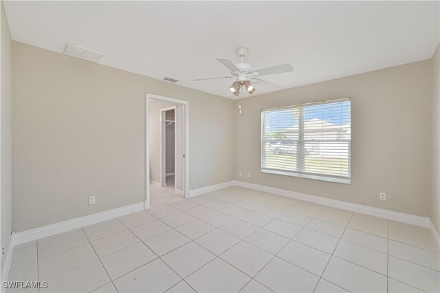 3831 Pelican Blvd, Cape Coral, FL 33914 - spare room with visible vents, baseboards, a ceiling fan, and light tile patterned floors