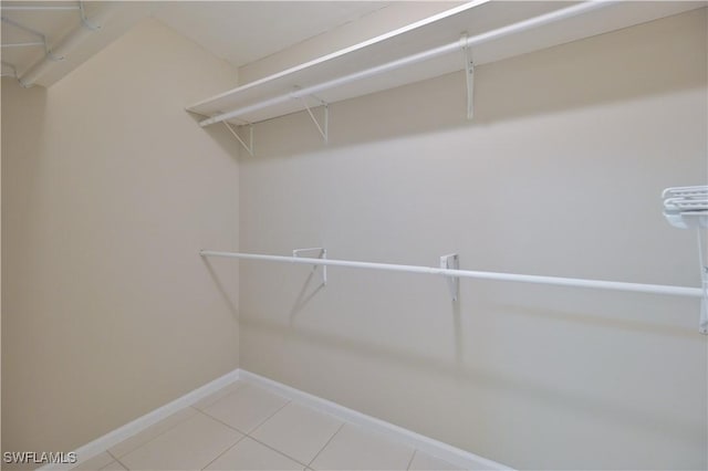 3831 Pelican Blvd, Cape Coral, FL 33914 - spacious closet featuring light tile patterned flooring
