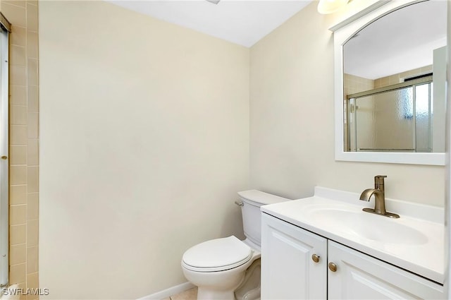 full bath featuring vanity, a stall shower, and toilet