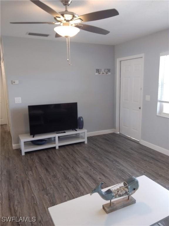 787 106th Ave N, Naples, FL 34108 - living area featuring a ceiling fan, baseboards, and wood finished floors