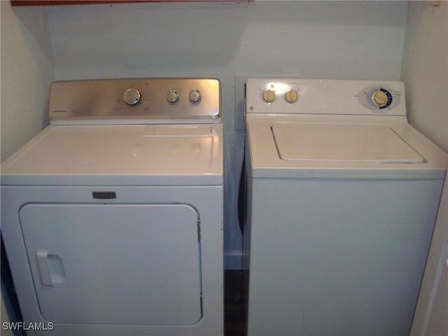 787 106th Ave N, Naples, FL 34108 - clothes washing area with washing machine and dryer