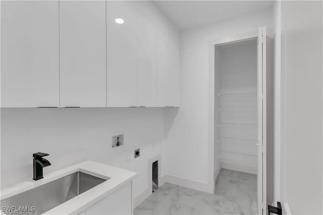 laundry room with electric dryer hookup, marble finish floor, a sink, washer hookup, and cabinet space
