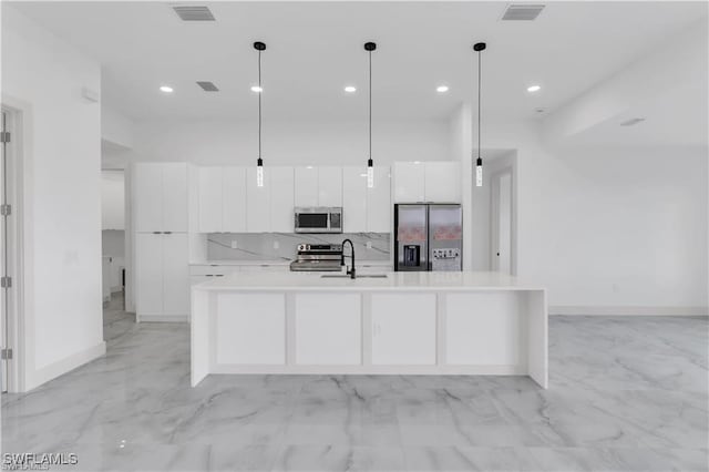 kitchen featuring white cabinetry, visible vents, modern cabinets, appliances with stainless steel finishes, and marble finish floor