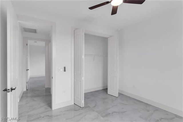 unfurnished bedroom featuring visible vents, baseboards, and marble finish floor