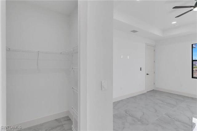 interior space featuring marble finish floor, ceiling fan, baseboards, and recessed lighting